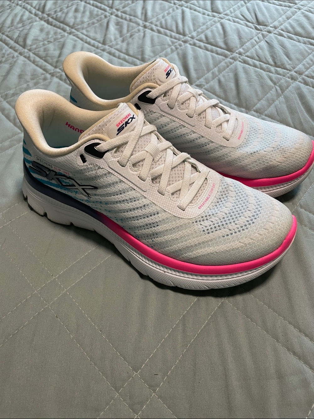Skechers White Athletic Shoes with Pink Trim and Blue Accent